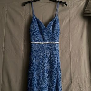 A blue Lacey, glittery dress